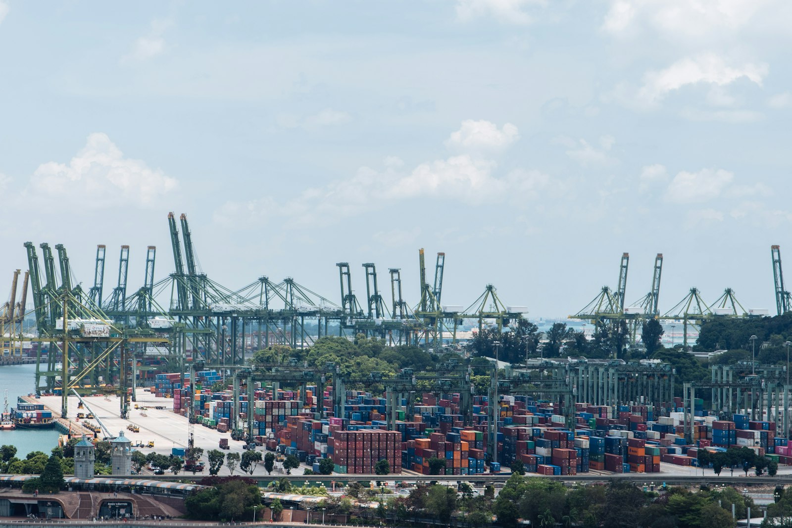 A harbour full of stacked containers and gantry cranes.